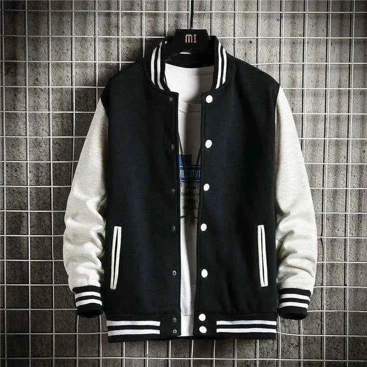 Man in black and white baseball jacket - Premium Baseball Jacket from The Divine Shop - Just Rs.2999! Shop now at The Divine Shop