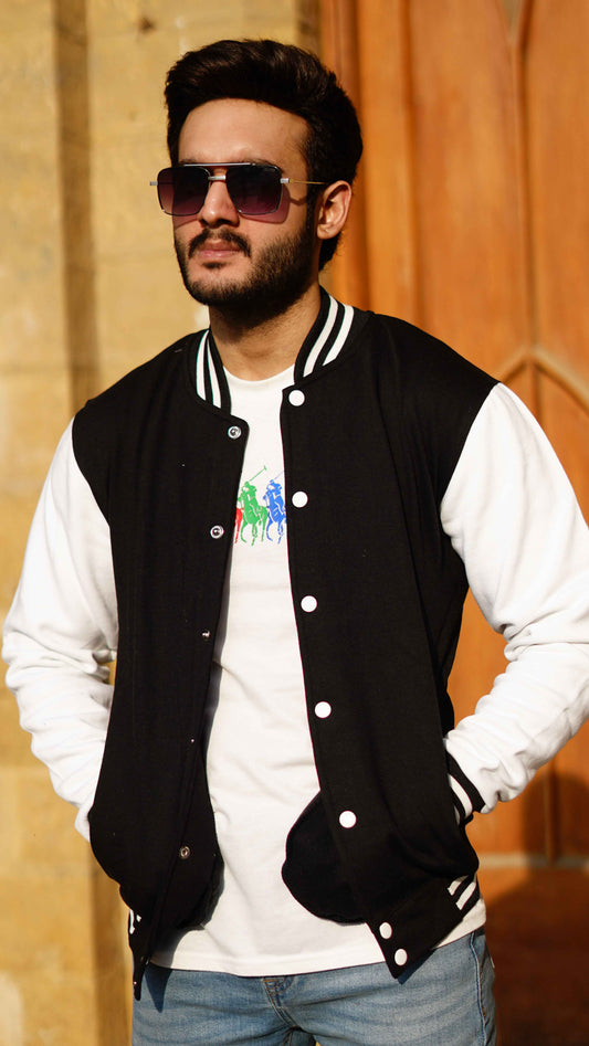 Man in black and white baseball jacket - Premium Baseball Jacket from The Divine Shop - Just Rs.2999! Shop now at The Divine Shop