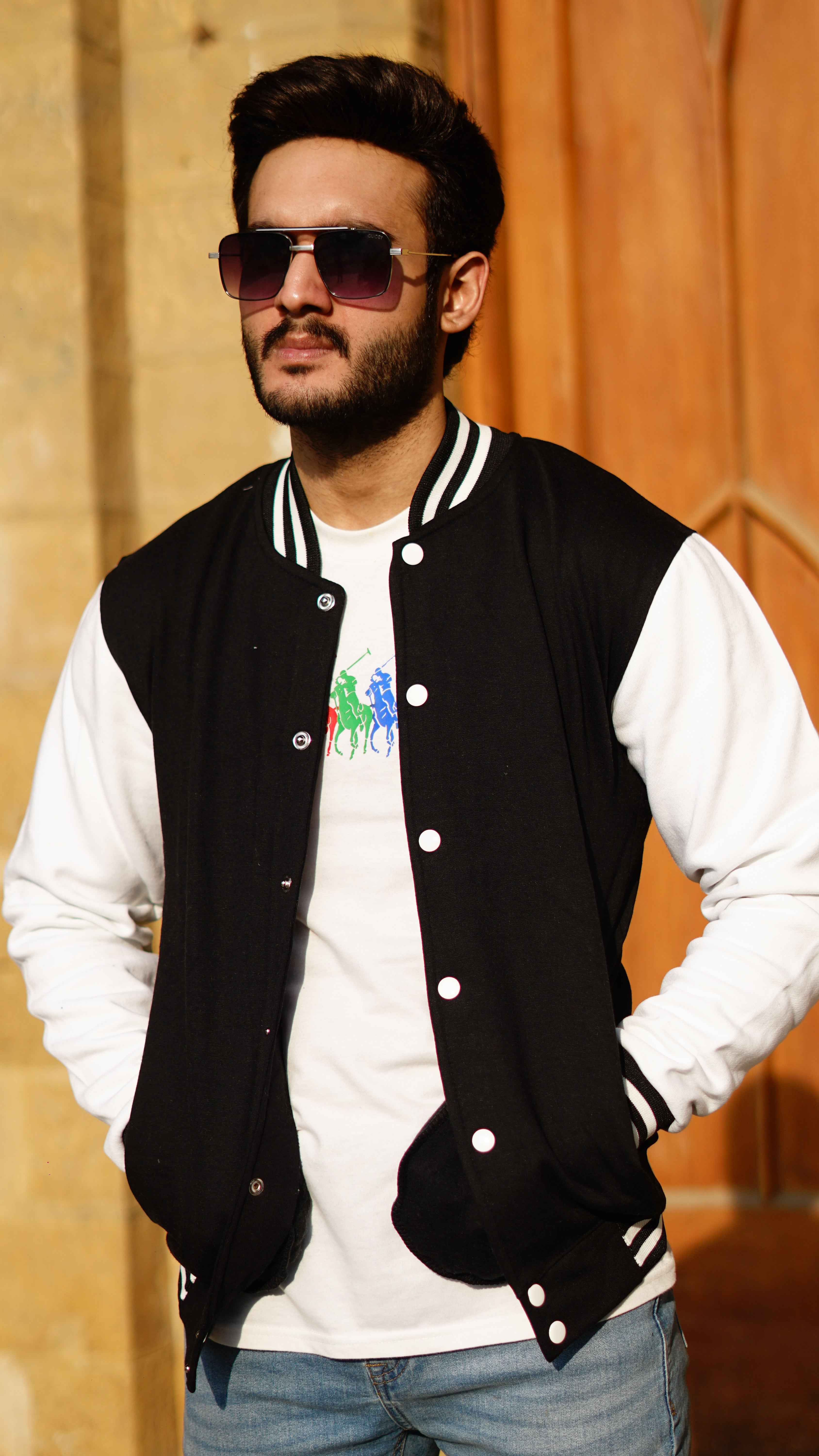 Man in black and white baseball jacket - Premium Baseball Jacket from The Divine Shop - Just Rs.2999! Shop now at The Divine Shop
