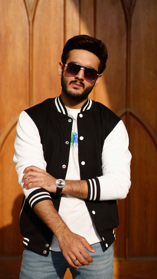 Man in black and white baseball jacket - Premium Baseball Jacket from The Divine Shop - Just Rs.2999! Shop now at The Divine Shop